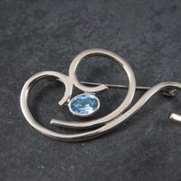Vintage Sterling Blue Rhinestone Swirl Brooch