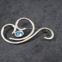 Vintage Sterling Blue Rhinestone Swirl Brooch