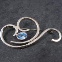 Vintage Sterling Blue Rhinestone Swirl Brooch