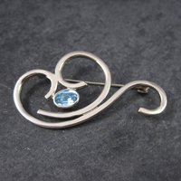Vintage Sterling Blue Rhinestone Swirl Brooch