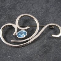 Vintage Sterling Blue Rhinestone Swirl Brooch