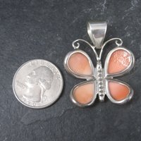 Sterling Carved Angel Skin Coral Butterfly Pendant