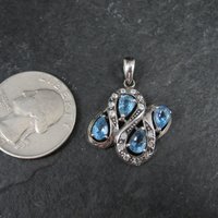 Unique Sterling Silver Blue Topaz & Diamond Pendant