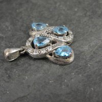 Unique Sterling Silver Blue Topaz & Diamond Pendant