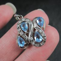 Unique Sterling Silver Blue Topaz & Diamond Pendant