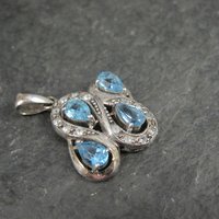 Unique Sterling Silver Blue Topaz & Diamond Pendant