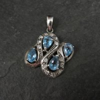 Unique Sterling Silver Blue Topaz & Diamond Pendant