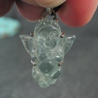 Carved Blue Topaz Cherub Pendant