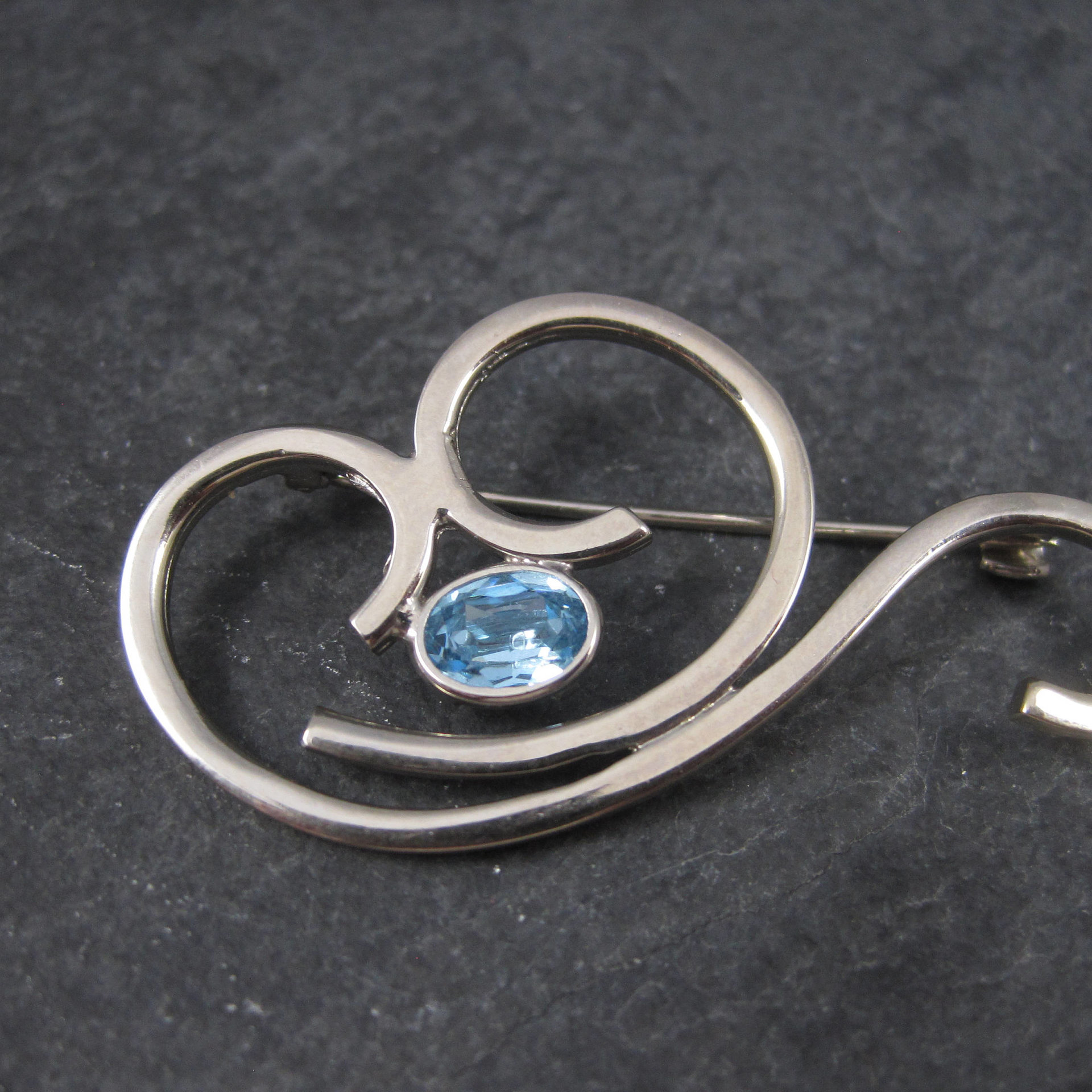 Vintage Sterling Blue Rhinestone Swirl Brooch