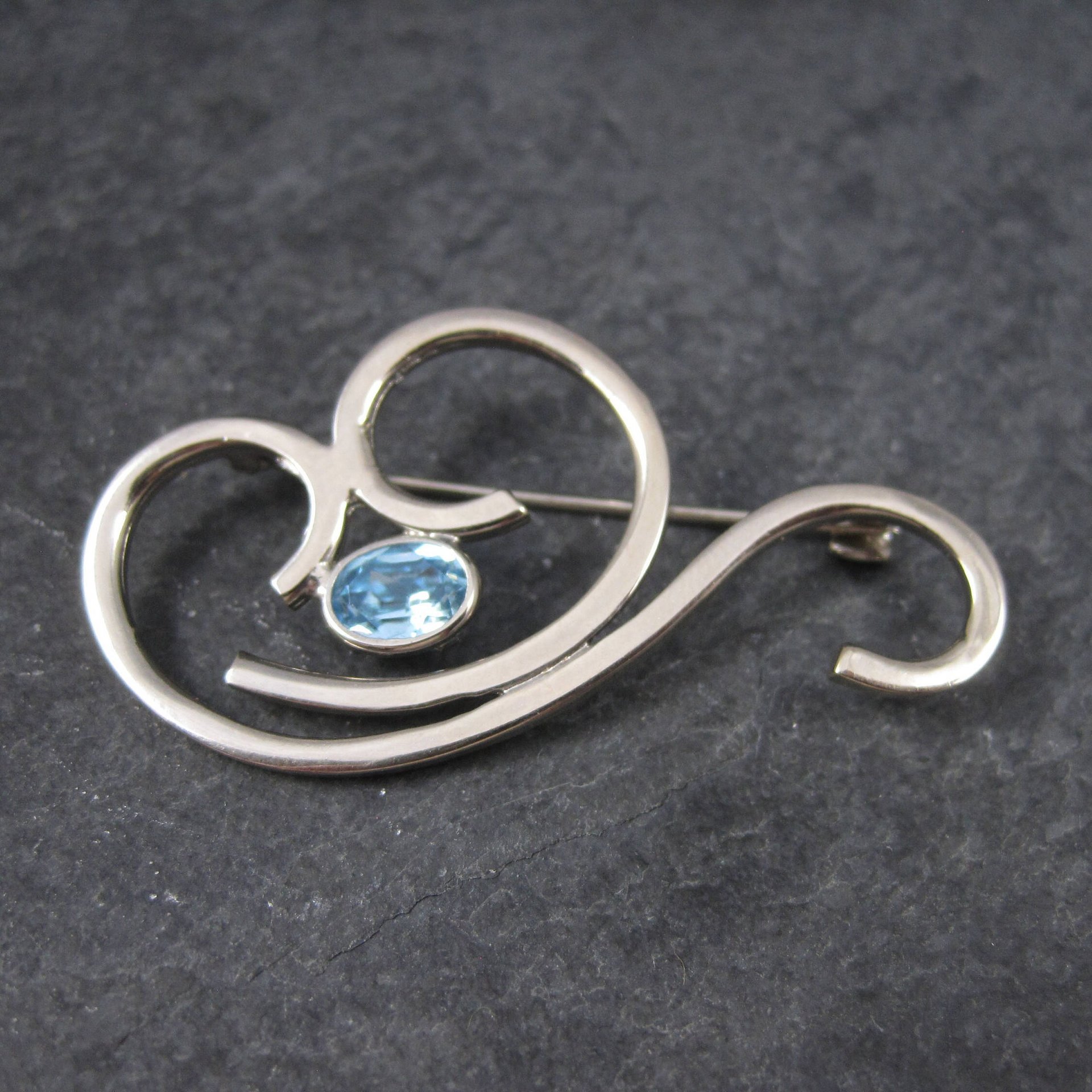 Vintage Sterling Blue Rhinestone Swirl Brooch