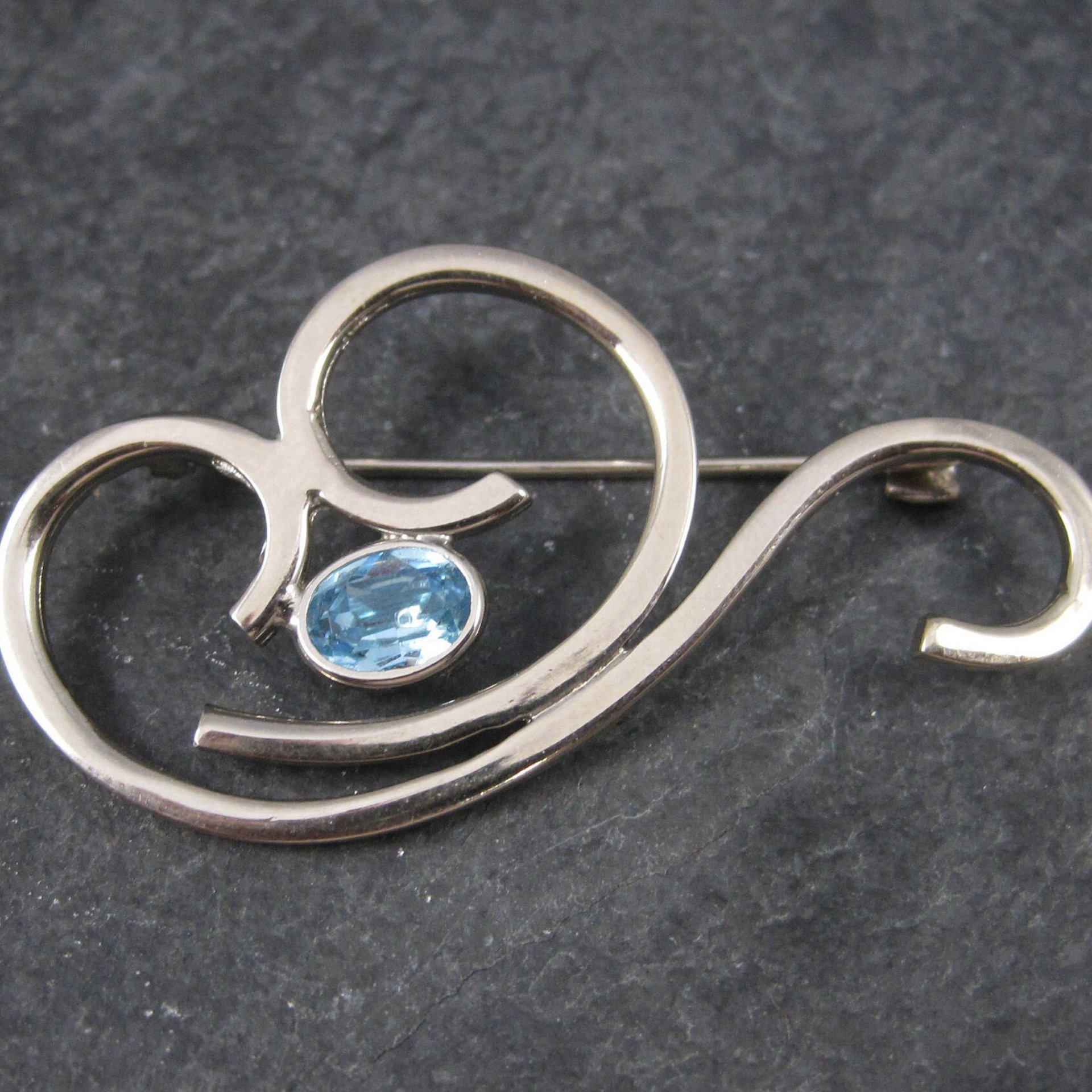 Vintage Sterling Blue Rhinestone Swirl Brooch