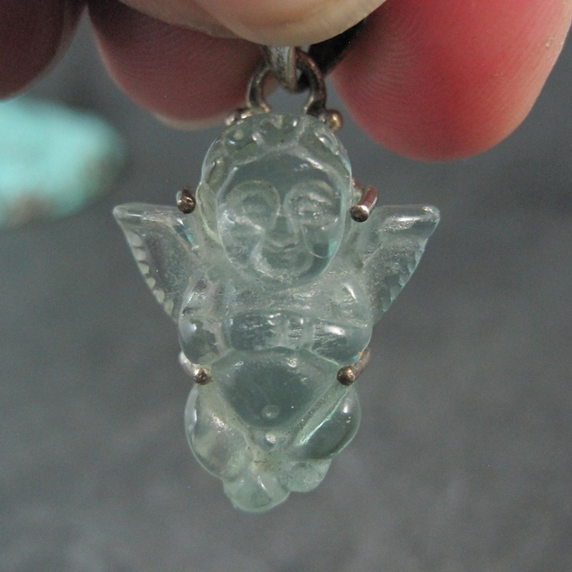 Carved Blue Topaz Cherub Pendant